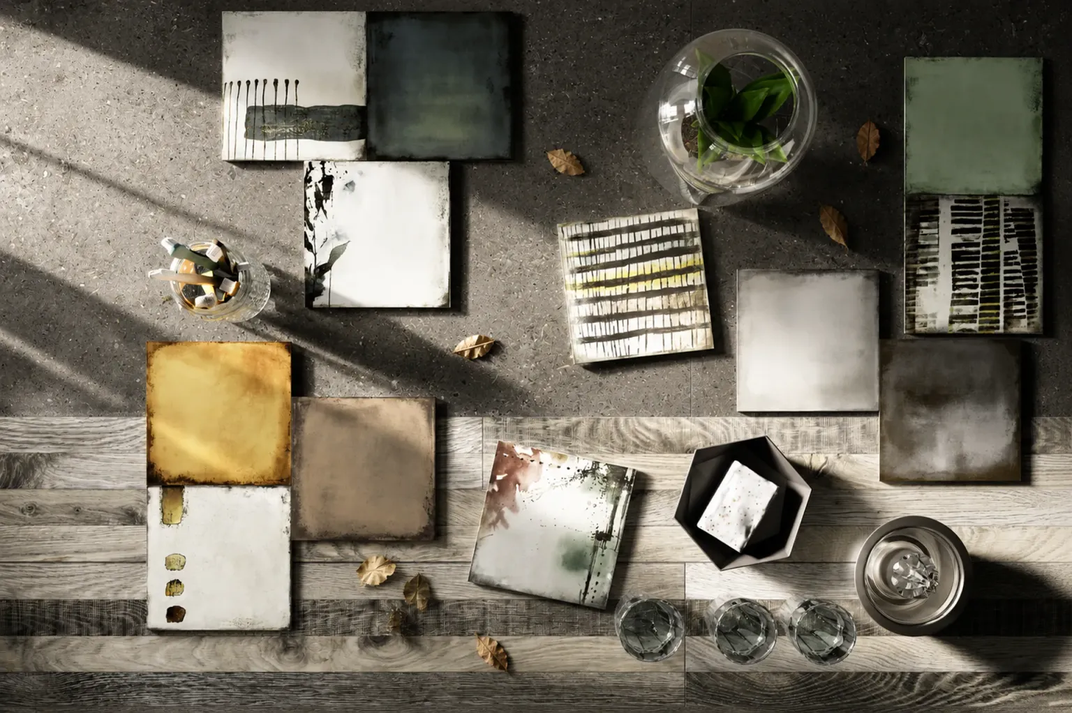 Composizione zenitale di piastrelle decorative, stoviglie e piante su pavimento grigio